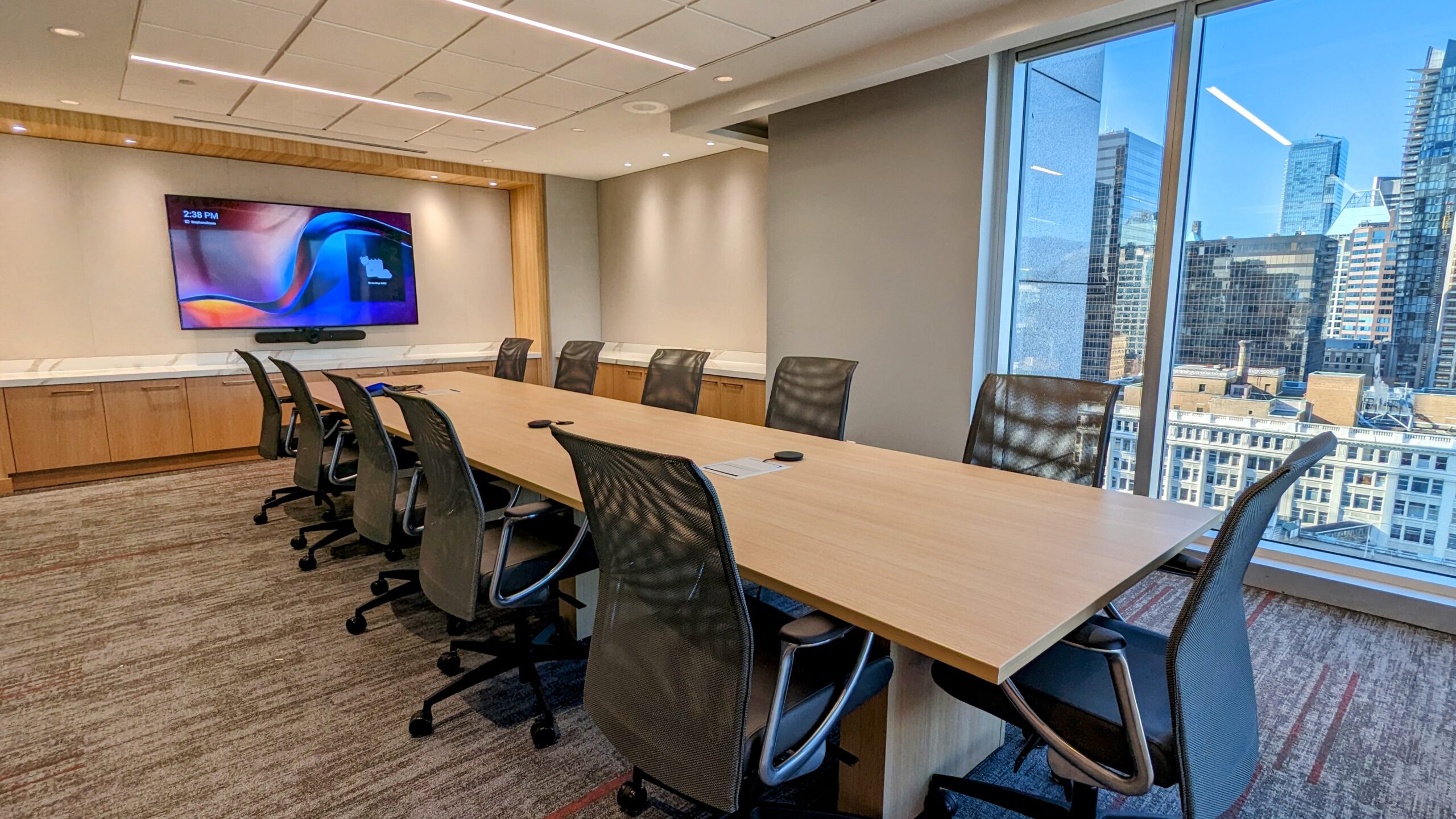 The main boardroom - Stephens Room - at LK Law's new downtown Vancouver office - featuring video conferencing AV solutions from Logitech.